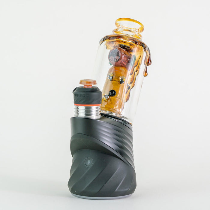 Save the Bees glass attachment installed on Puffco Peak Pro showing front view of honeycomb design